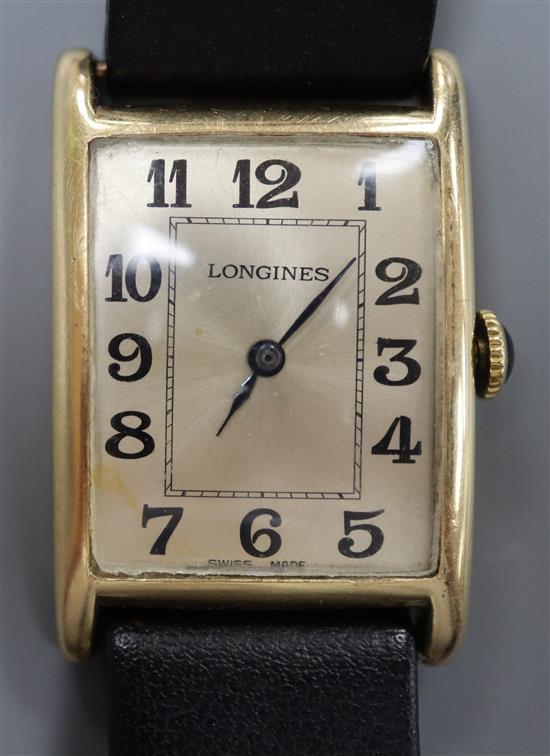 A gentlemans 14k yellow metal Longines manual wind wrist watch, with rectangular Arabic dial, on later associated strap.